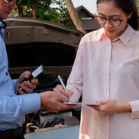 Women filling documents after a car wreck