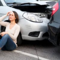 Woman on the floor with her head hurt after a car crash