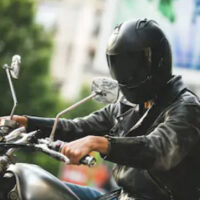 Man wearing a helmet on a motorcycle