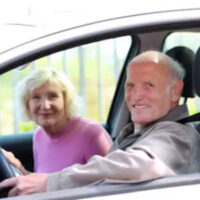 Older couple riding