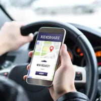 Rideshare Driver using his phone while driving
