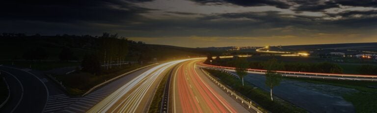 Illuminated highway at night
