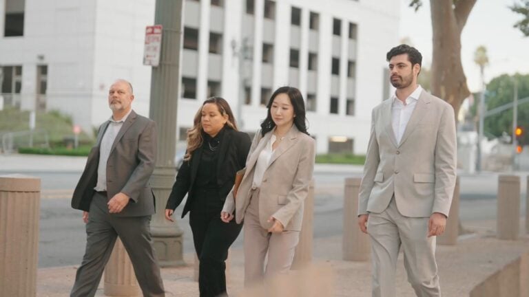 Four Solution Now Law Firm attorneys walking together on a downtown San Jose street